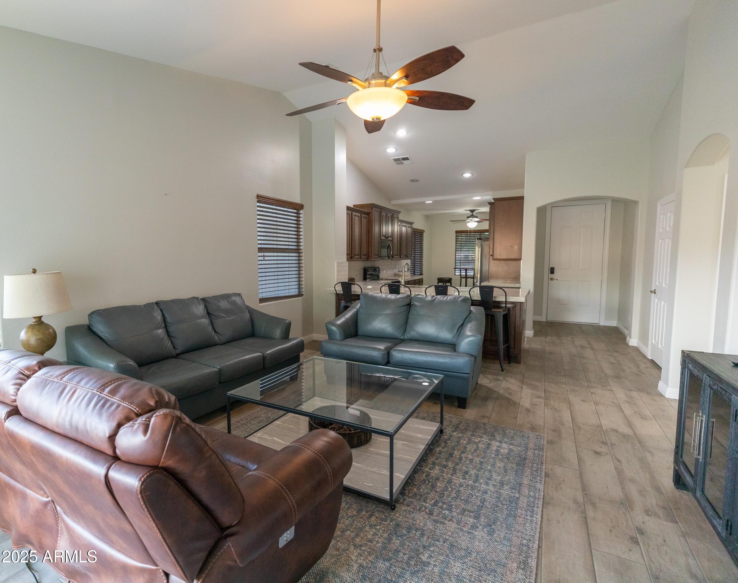 4759 South Granite Street Gilbert, AZ 85297 - Photo 11 of 29 a living room with furniture and kitchen view