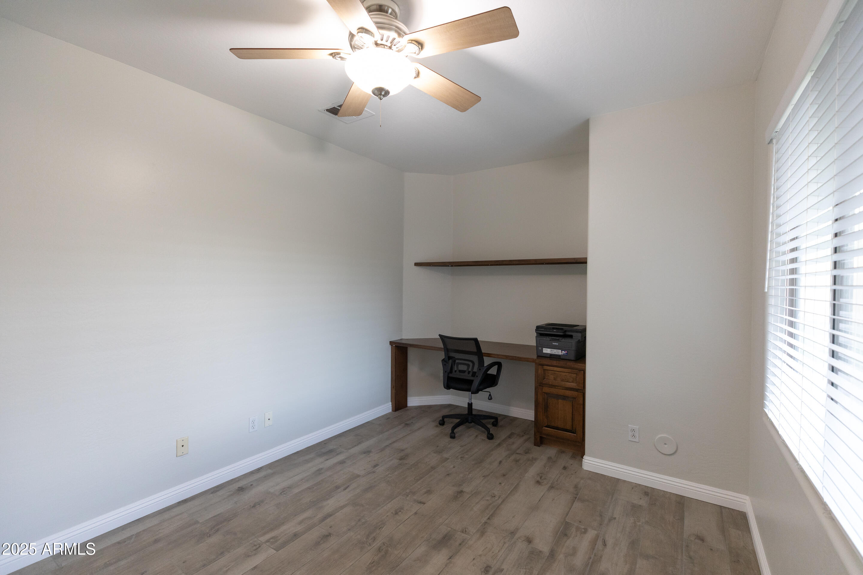 4759 South Granite Street Gilbert, AZ 85297 - Photo 12 of 29 a view of room with a window and wooden floor