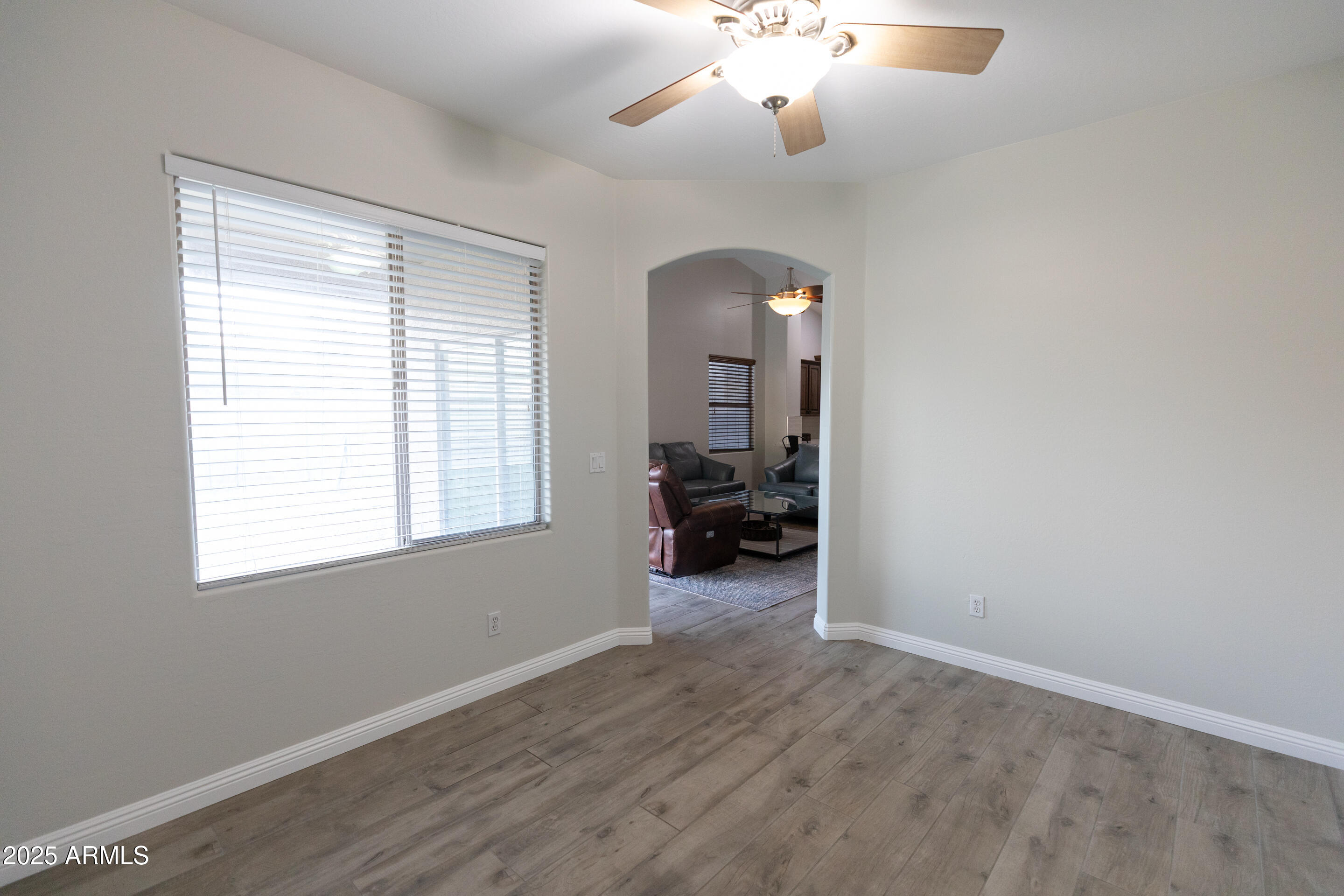 4759 South Granite Street Gilbert, AZ 85297 - Photo 13 of 29 an empty room with ceiling fan and window
