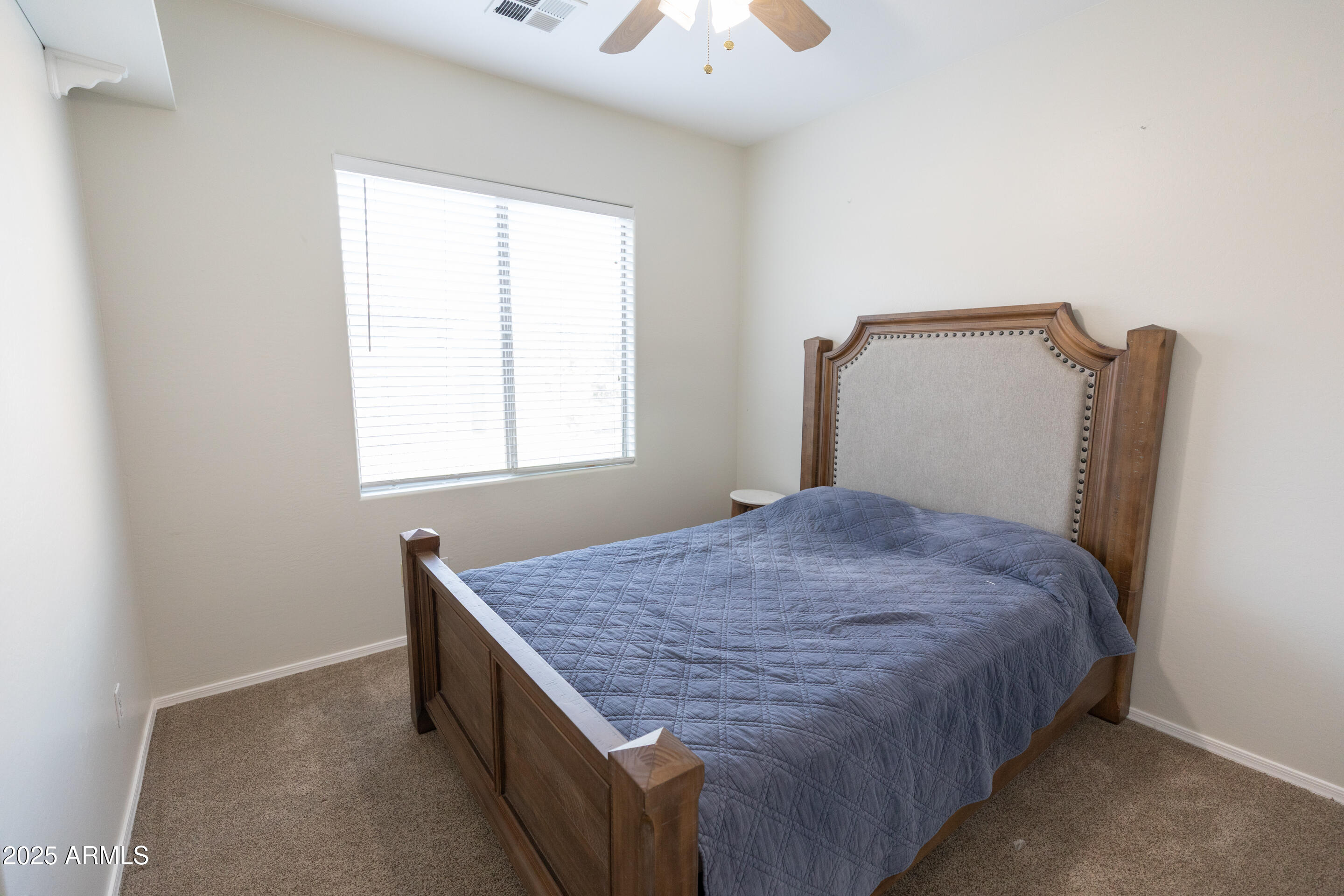 4759 South Granite Street Gilbert, AZ 85297 - Photo 14 of 29 a bedroom with a bed and a window