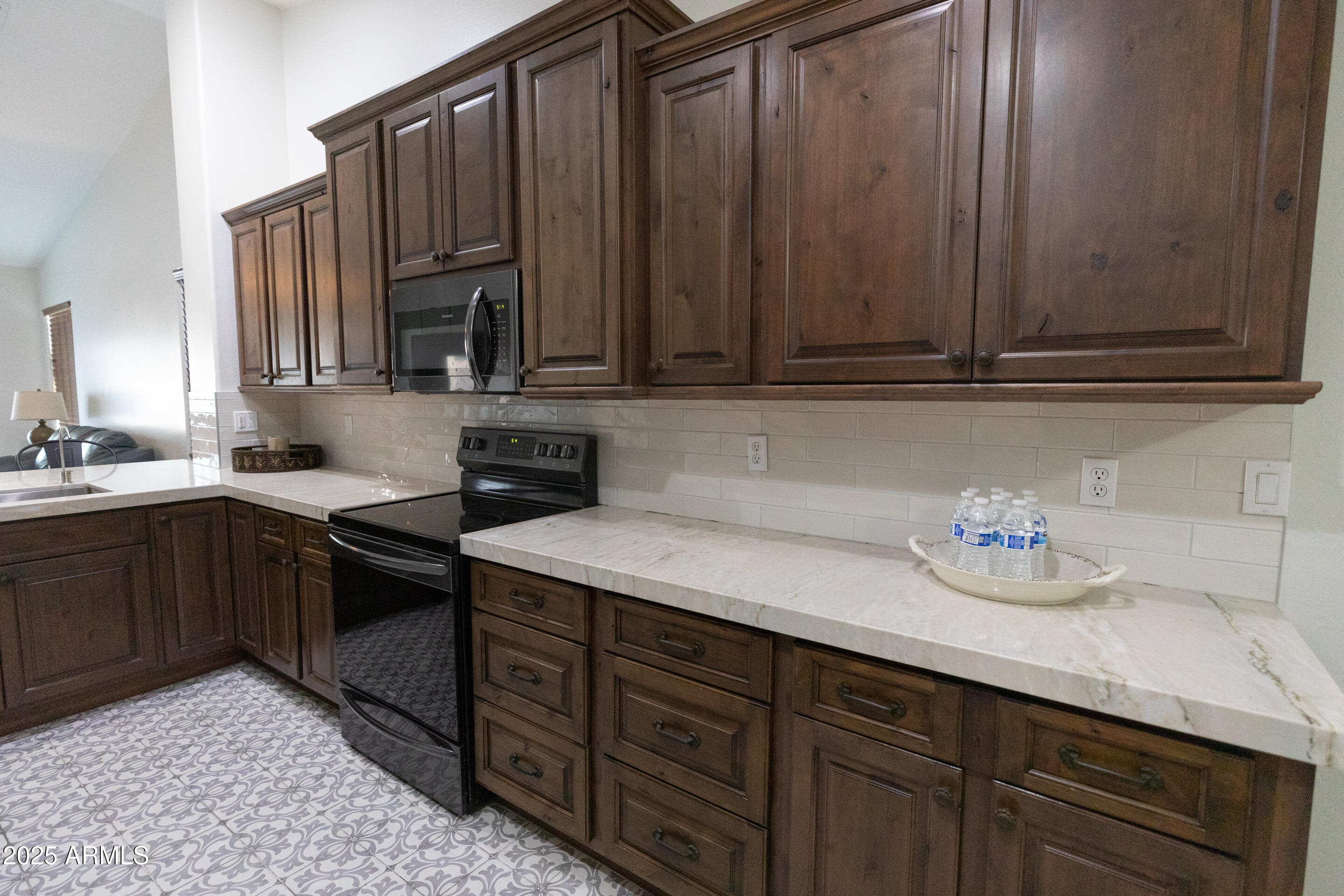 4759 South Granite Street Gilbert, AZ 85297 - Photo 9 of 29 a kitchen with stainless steel appliances granite countertop a sink dishwasher stove and cabinets with wooden floor