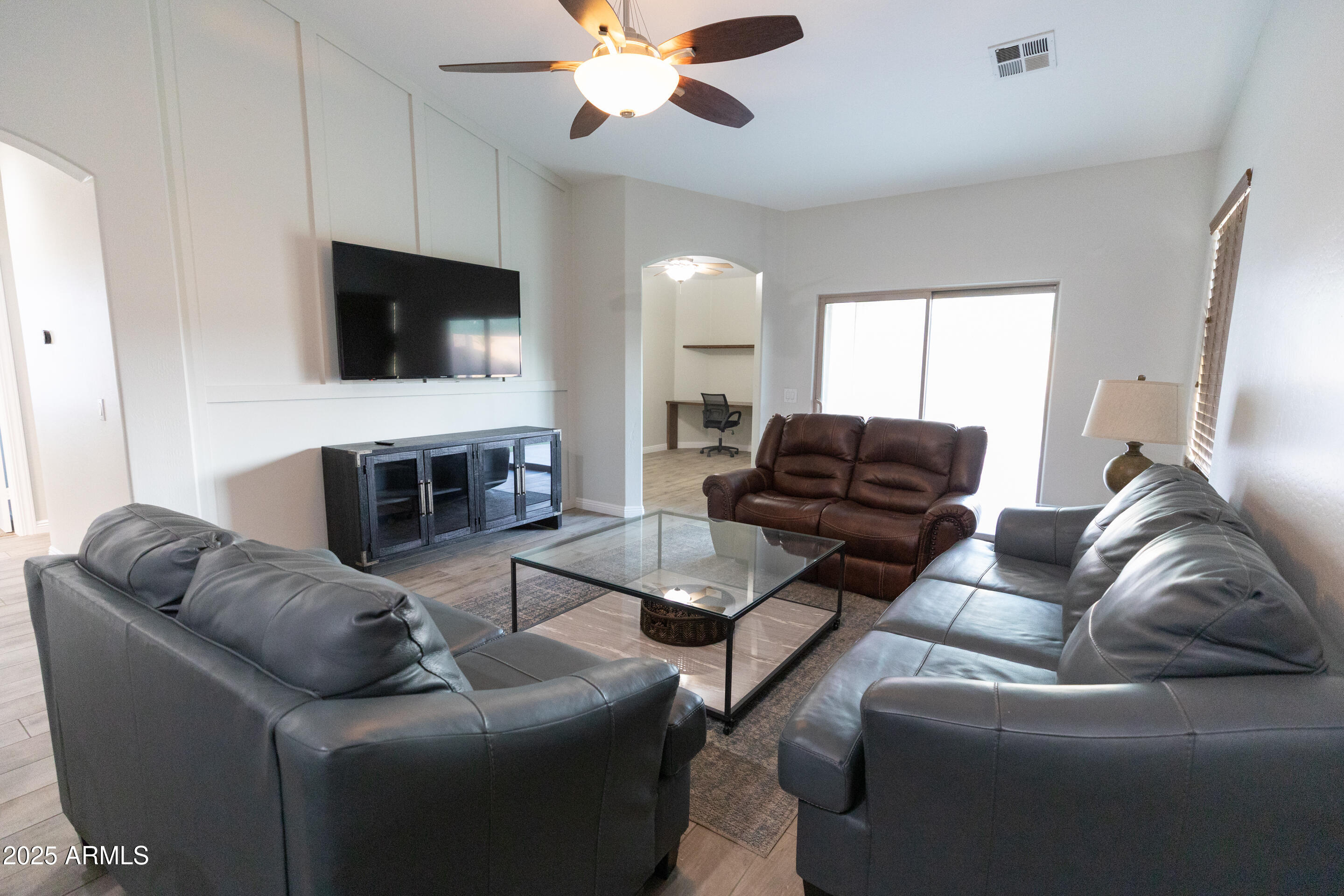 4759 South Granite Street Gilbert, AZ 85297 - Photo 10 of 29 a living room with furniture and a flat screen tv