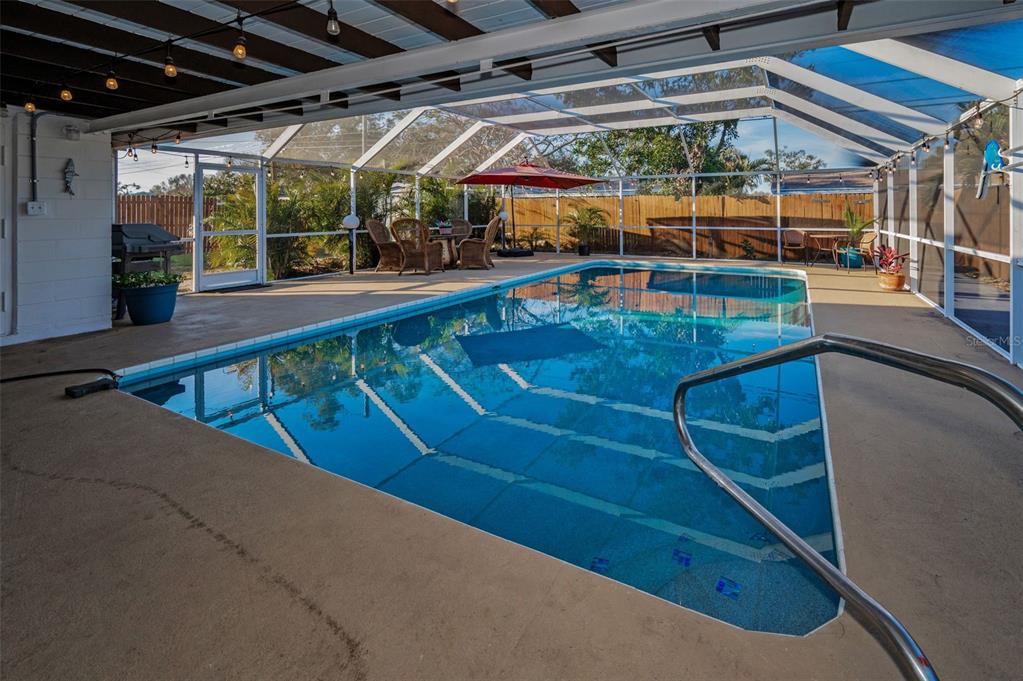 11077 87th Avenue Seminole, FL 33772 - Photo 27 of 32 a view of a swimming pool with a patio