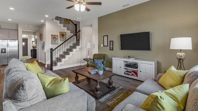 a living room with furniture and a table