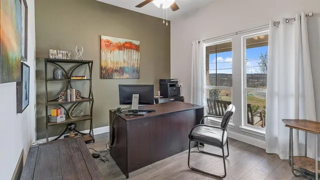 a view of bathroom with a tub and mirror