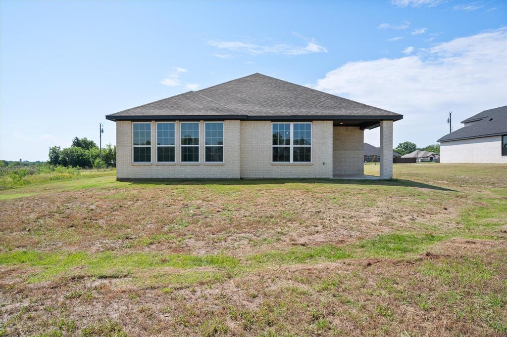 3400 Dobbins Road Corsicana, TX 75110 - Photo 34 of 40 a front view of a house with a yard
