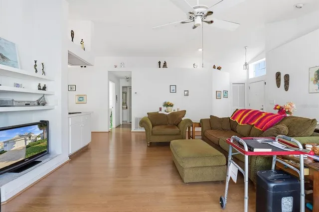 a kitchen with stainless steel appliances a sink stove refrigerator and cabinets