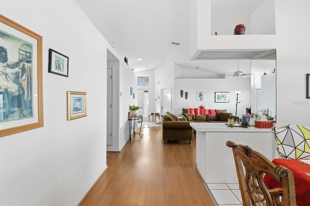 1046 Castille Drive Spring Hill, FL 34608 - Photo 12 of 44 a living room with furniture and flowers