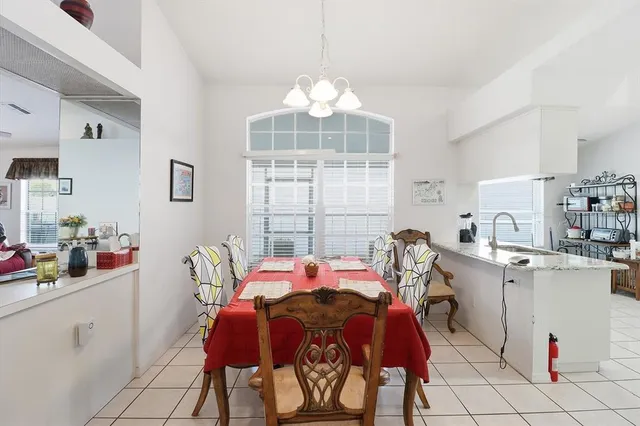 a kitchen with a stove and a white cabinets