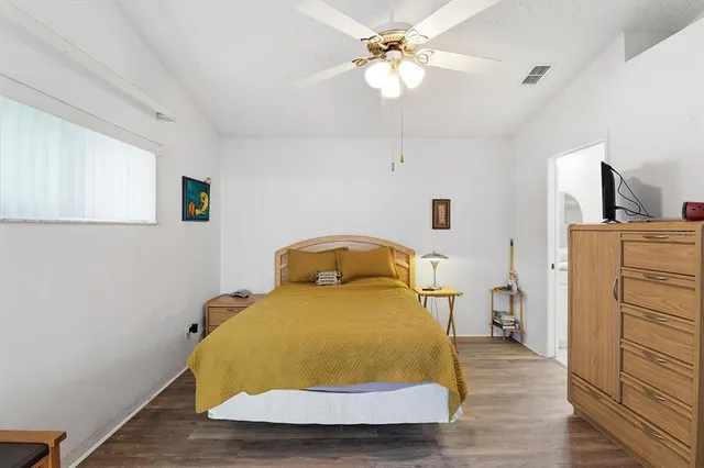 a bedroom with a bed and a dresser