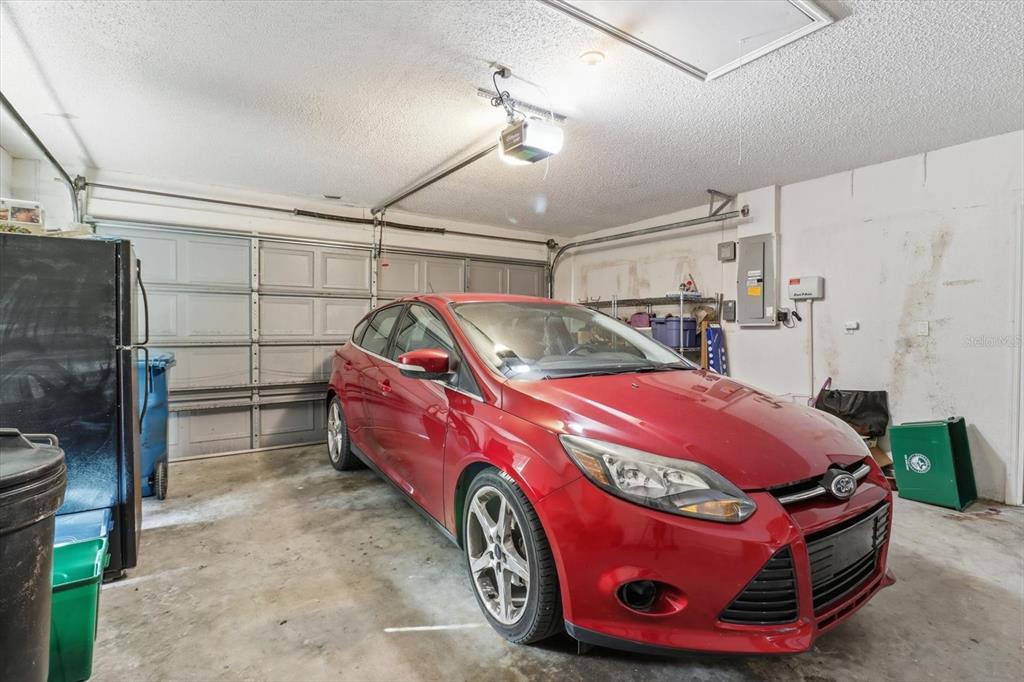1046 Castille Drive Spring Hill, FL 34608 - Photo 29 of 44 a car is parked in a garage