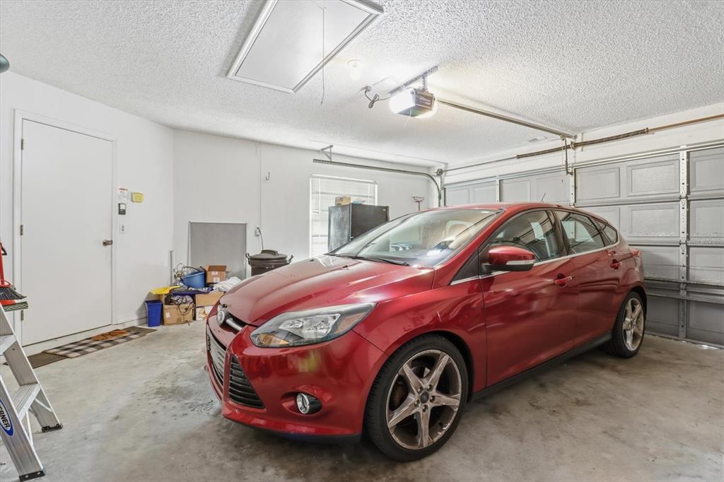 1046 Castille Drive Spring Hill, FL 34608 - Photo 30 of 44 a car is parked in a room