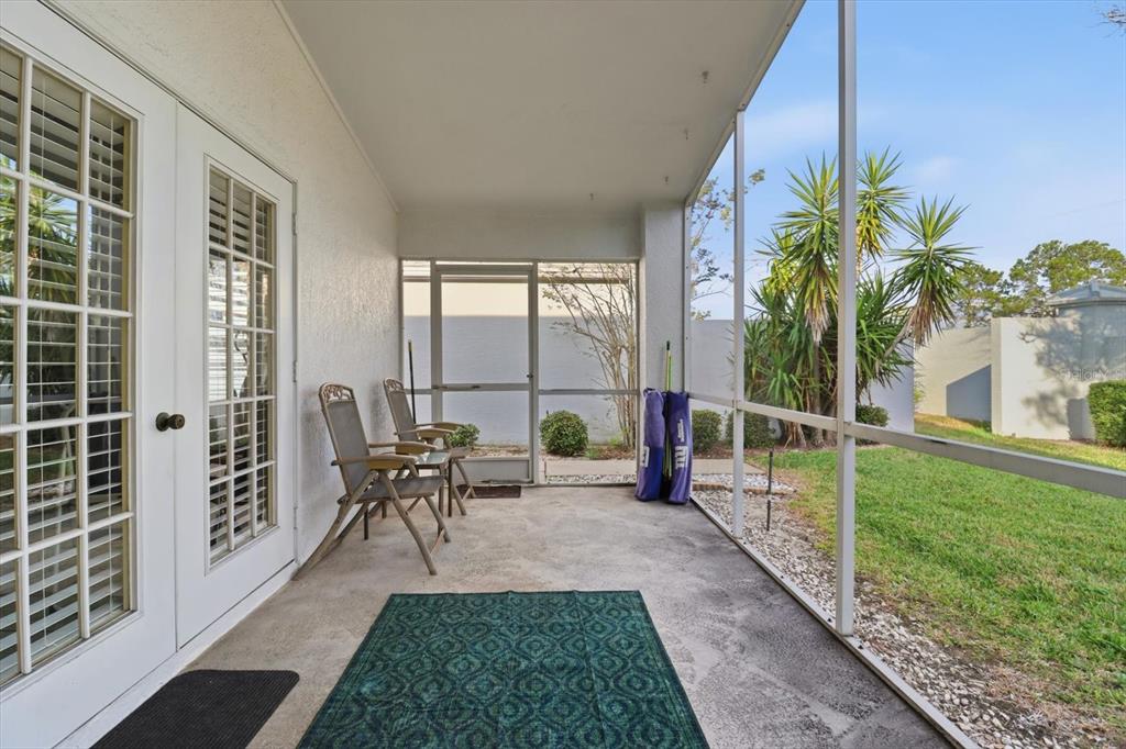1046 Castille Drive Spring Hill, FL 34608 - Photo 31 of 44 a view of a house with backyard sitting area and garden