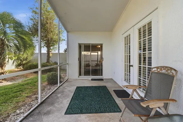 an aerial view of residential houses with outdoor space and swimming pool