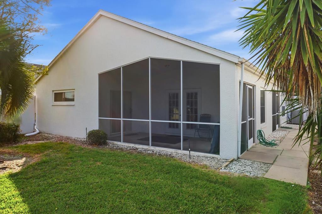 1046 Castille Drive Spring Hill, FL 34608 - Photo 35 of 44 a view of an house with backyard space and garden