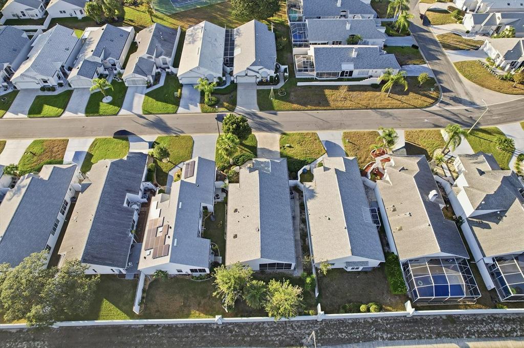 1046 Castille Drive Spring Hill, FL 34608 - Photo 39 of 44 an aerial view of residential houses with outdoor space and parking