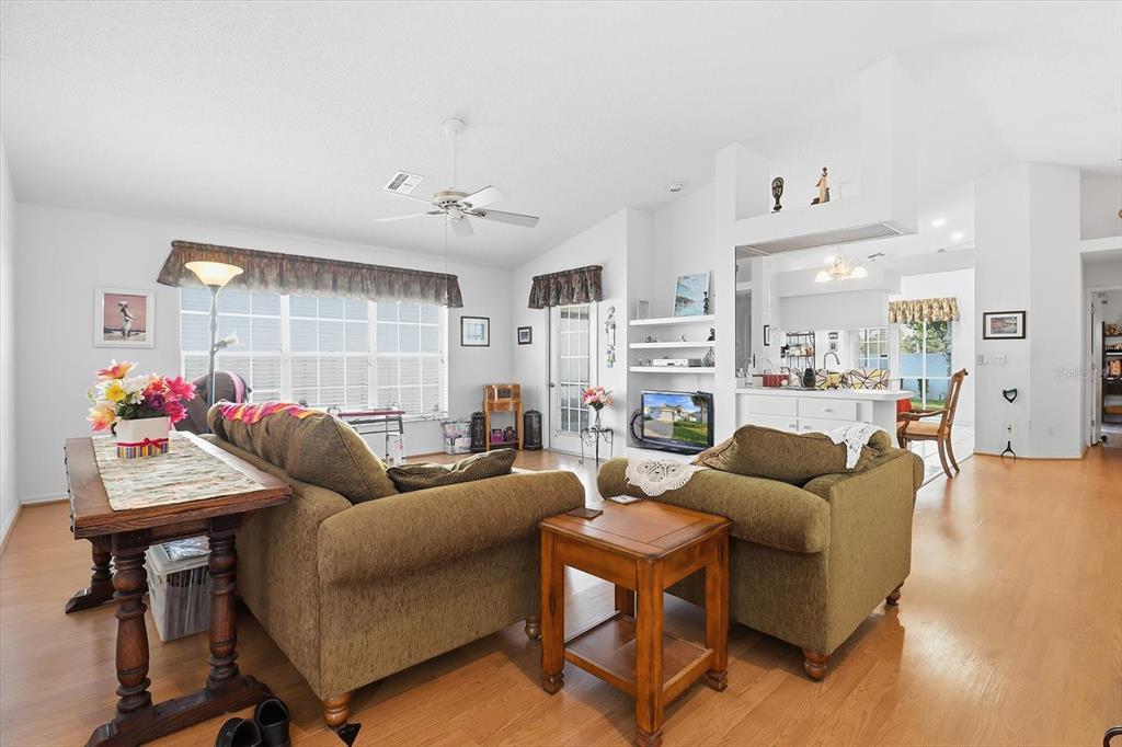 1046 Castille Drive Spring Hill, FL 34608 - Photo 7 of 44 a living room with furniture and a large window