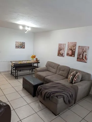 a living room with couches and a coffee table