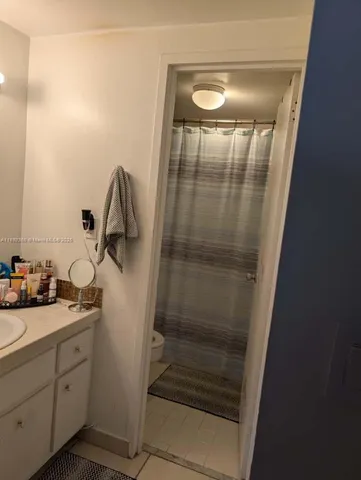 a bathroom with a sink and mirror