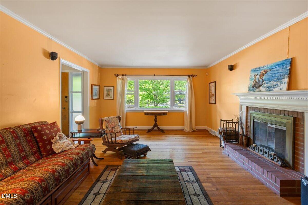 3107 Dixon Road Durham, NC 27707 - Photo 6 of 35 a living room with furniture and a fireplace