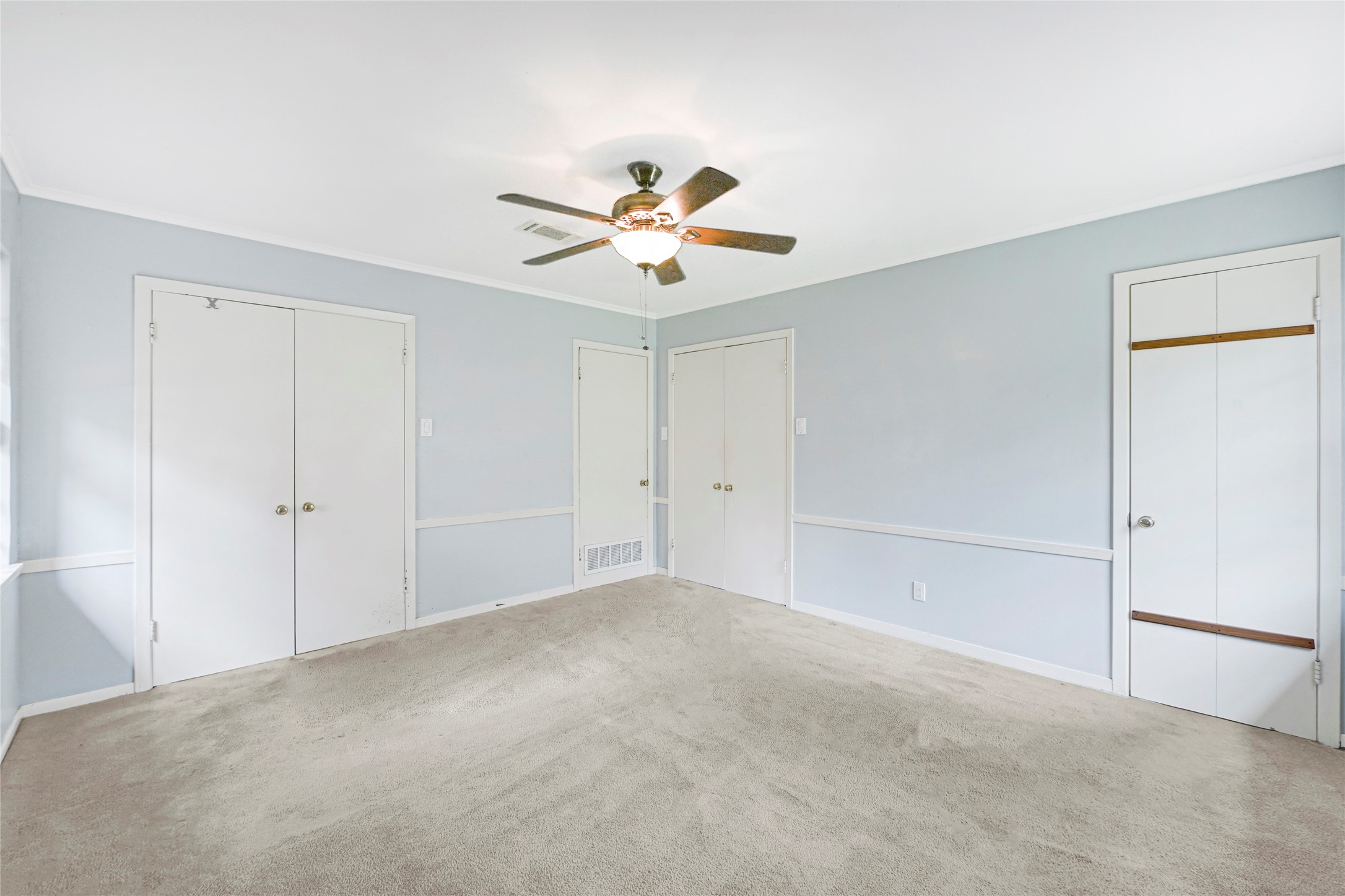 5510 Aldine Bender Road Houston, TX 77032 - Photo 17 of 24 a view of a room with a ceiling fan and a window