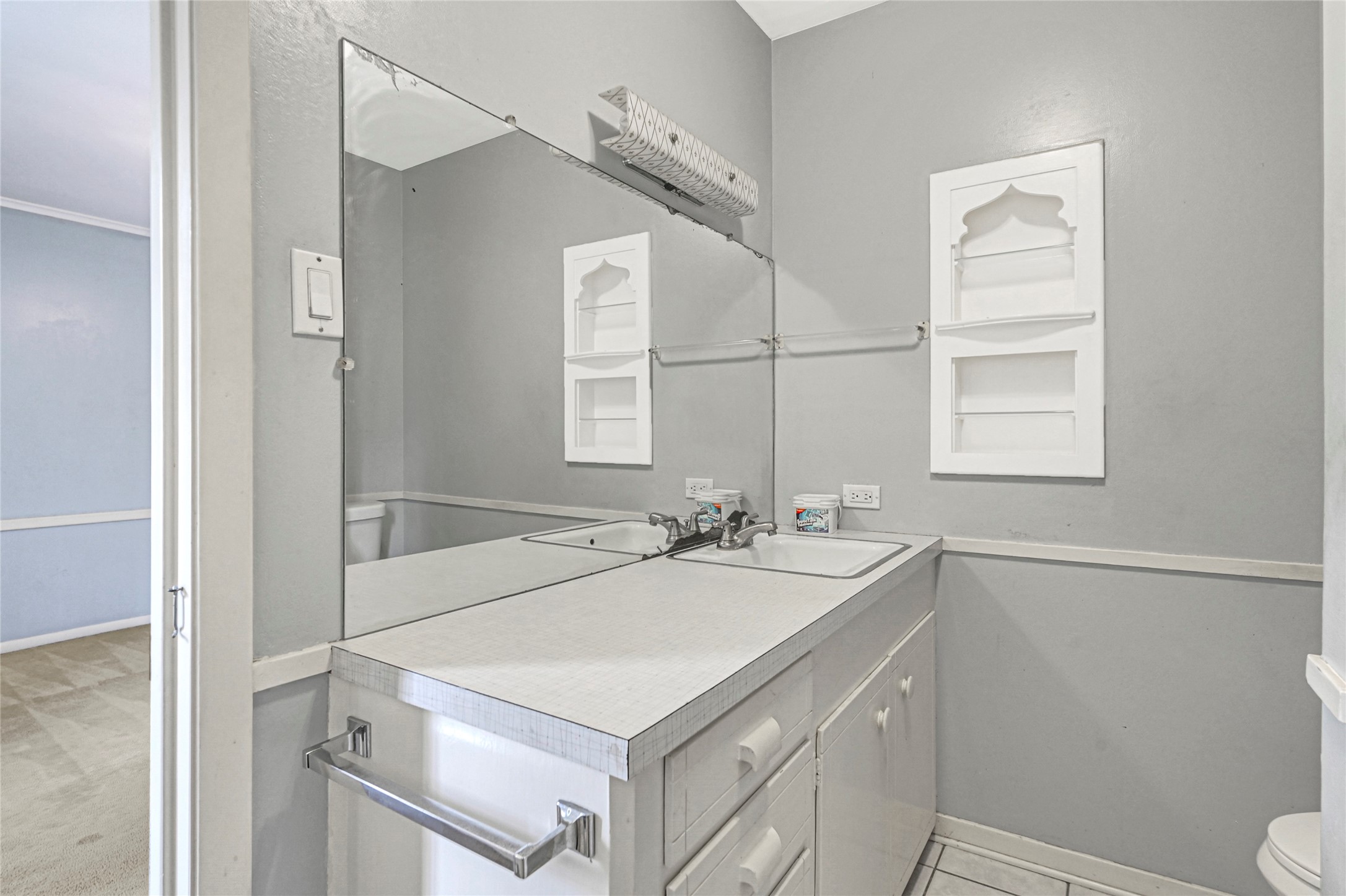 5510 Aldine Bender Road Houston, TX 77032 - Photo 18 of 24 a bathroom with a sink a toilet and a mirror