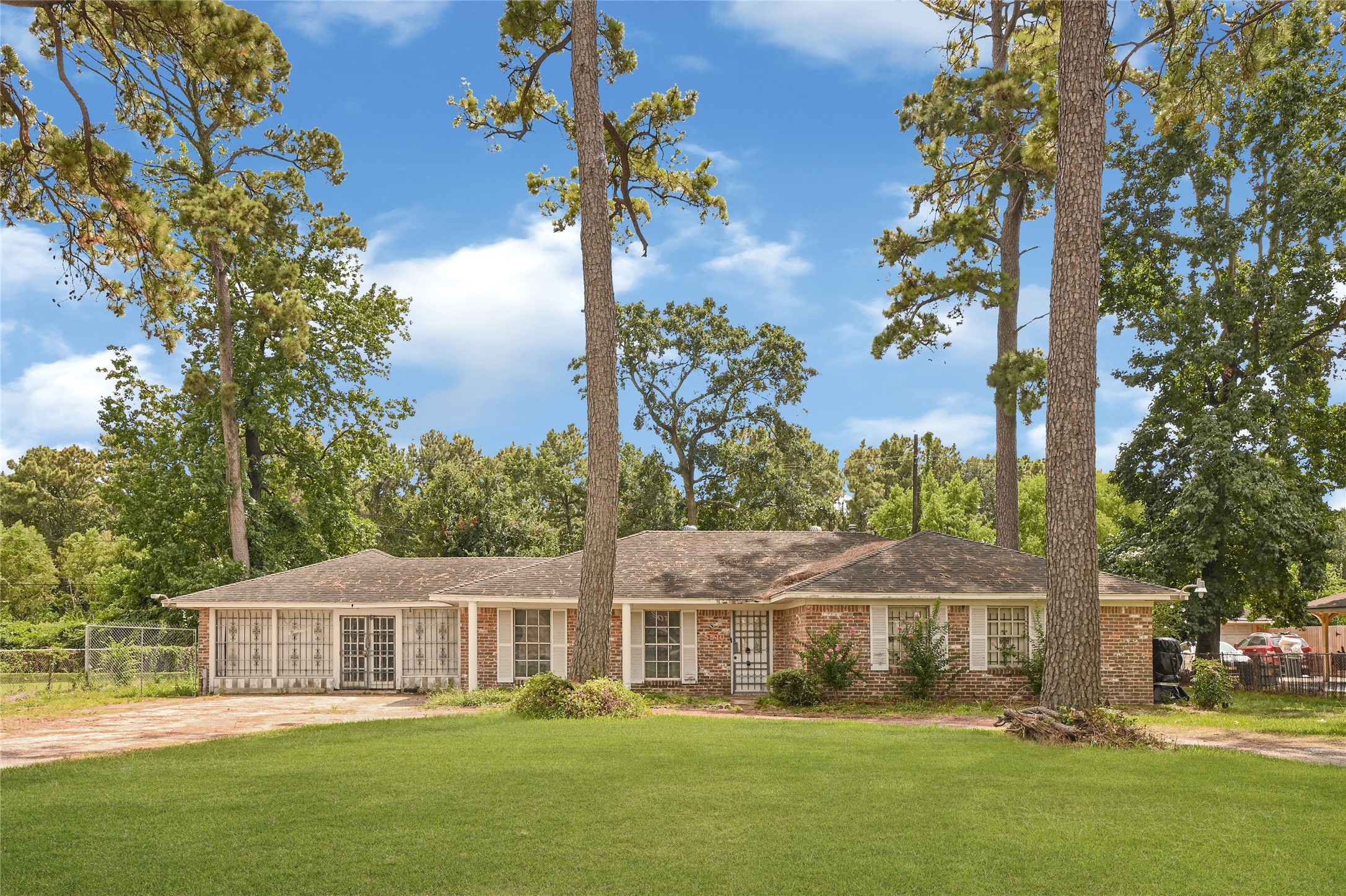 5510 Aldine Bender Road Houston, TX 77032 - Photo 2 of 24 a front view of a house with garden and trees