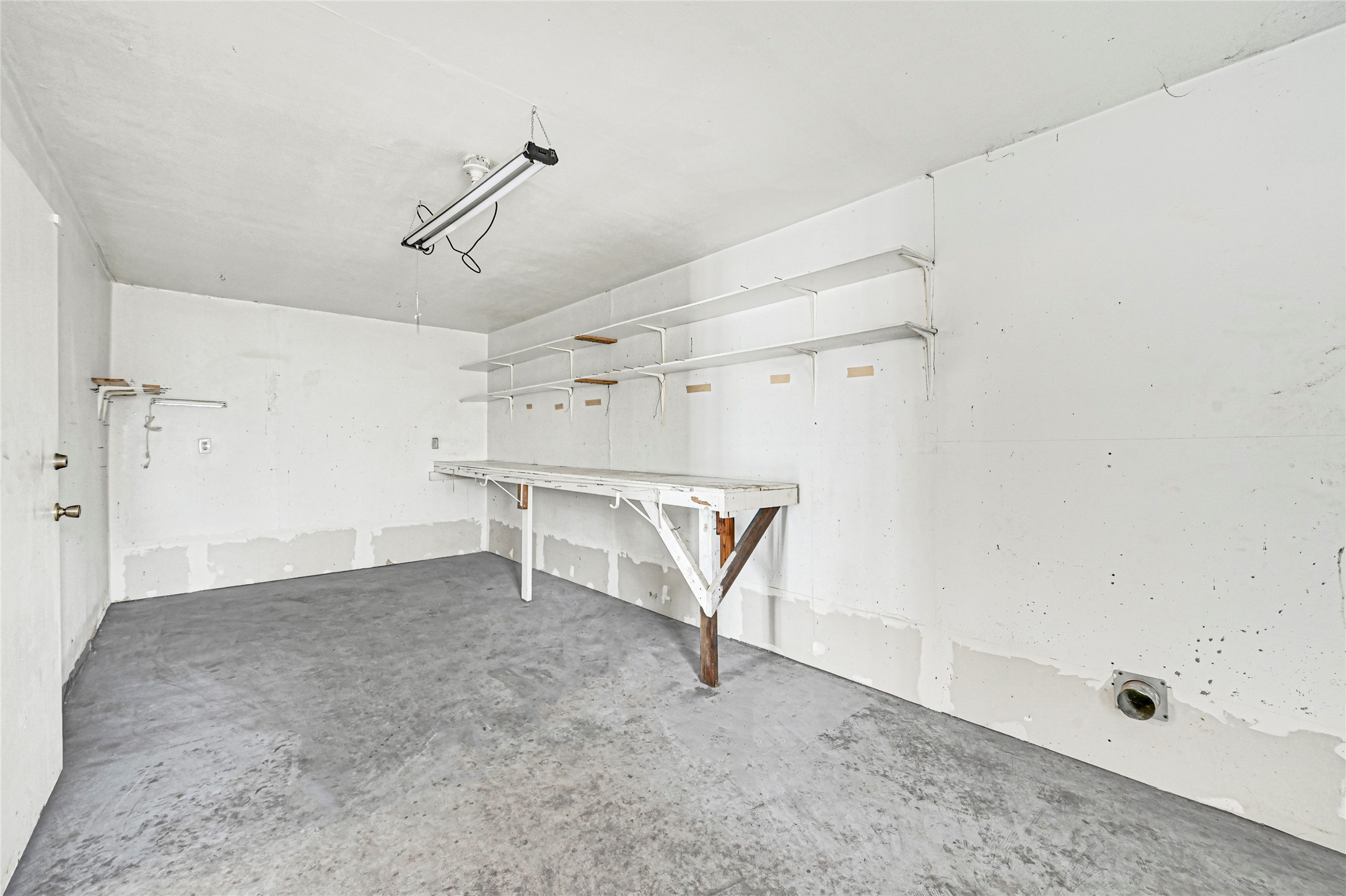 5510 Aldine Bender Road Houston, TX 77032 - Photo 23 of 24 a view of a room with racks on the wall