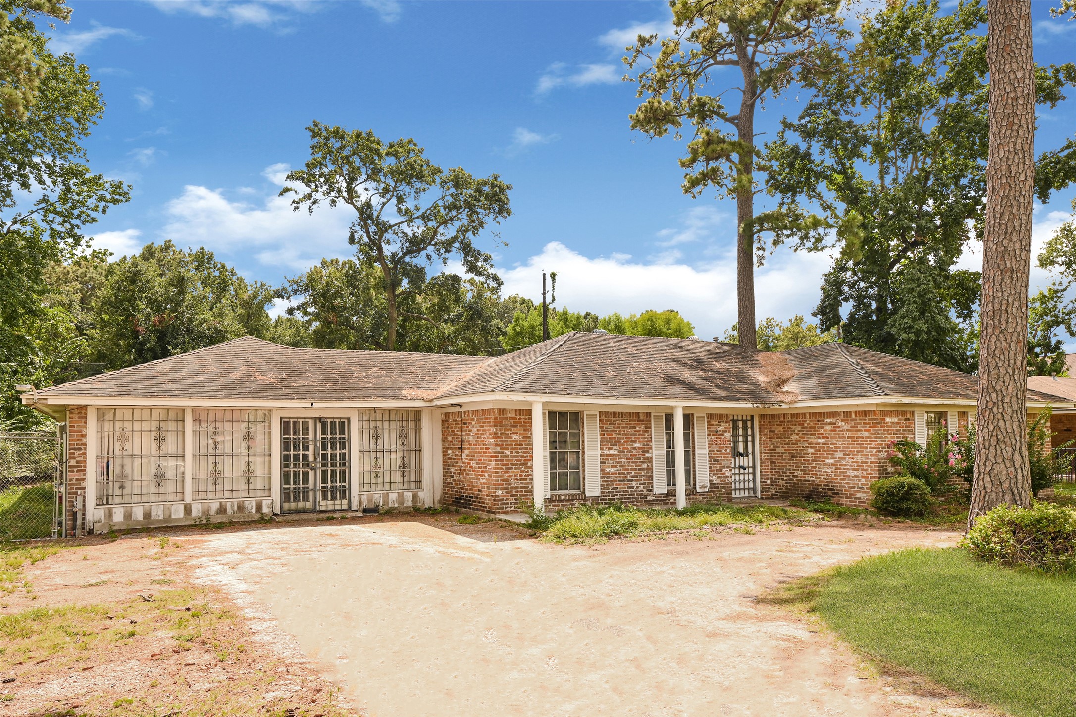 5510 Aldine Bender Road Houston, TX 77032 - Photo 4 of 24 a front view of a house with a garden