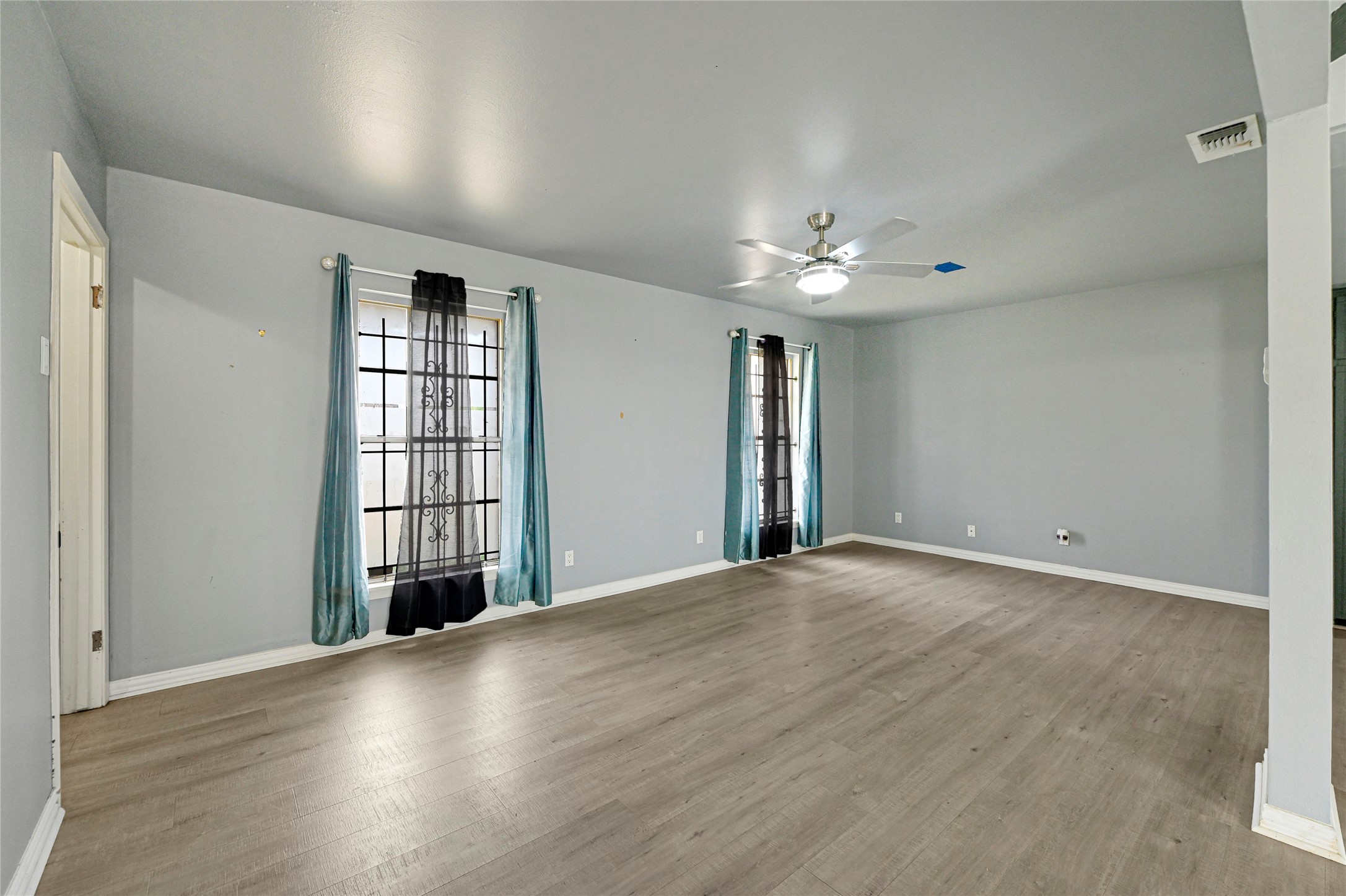 5510 Aldine Bender Road Houston, TX 77032 - Photo 6 of 24 wooden floor in an empty room with a window