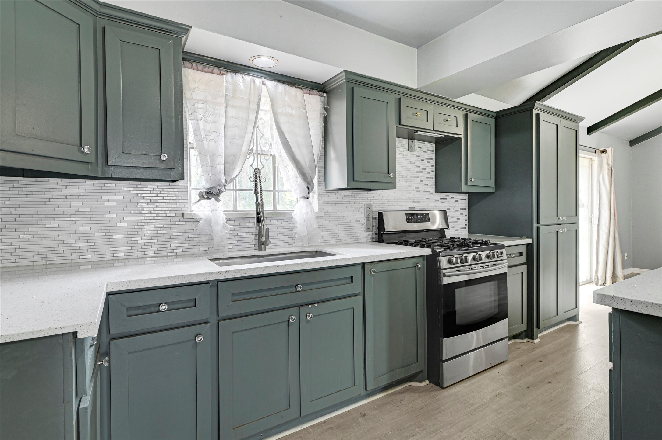 5510 Aldine Bender Road Houston, TX 77032 - Photo 7 of 24 a kitchen with stainless steel appliances granite countertop a sink and a stove