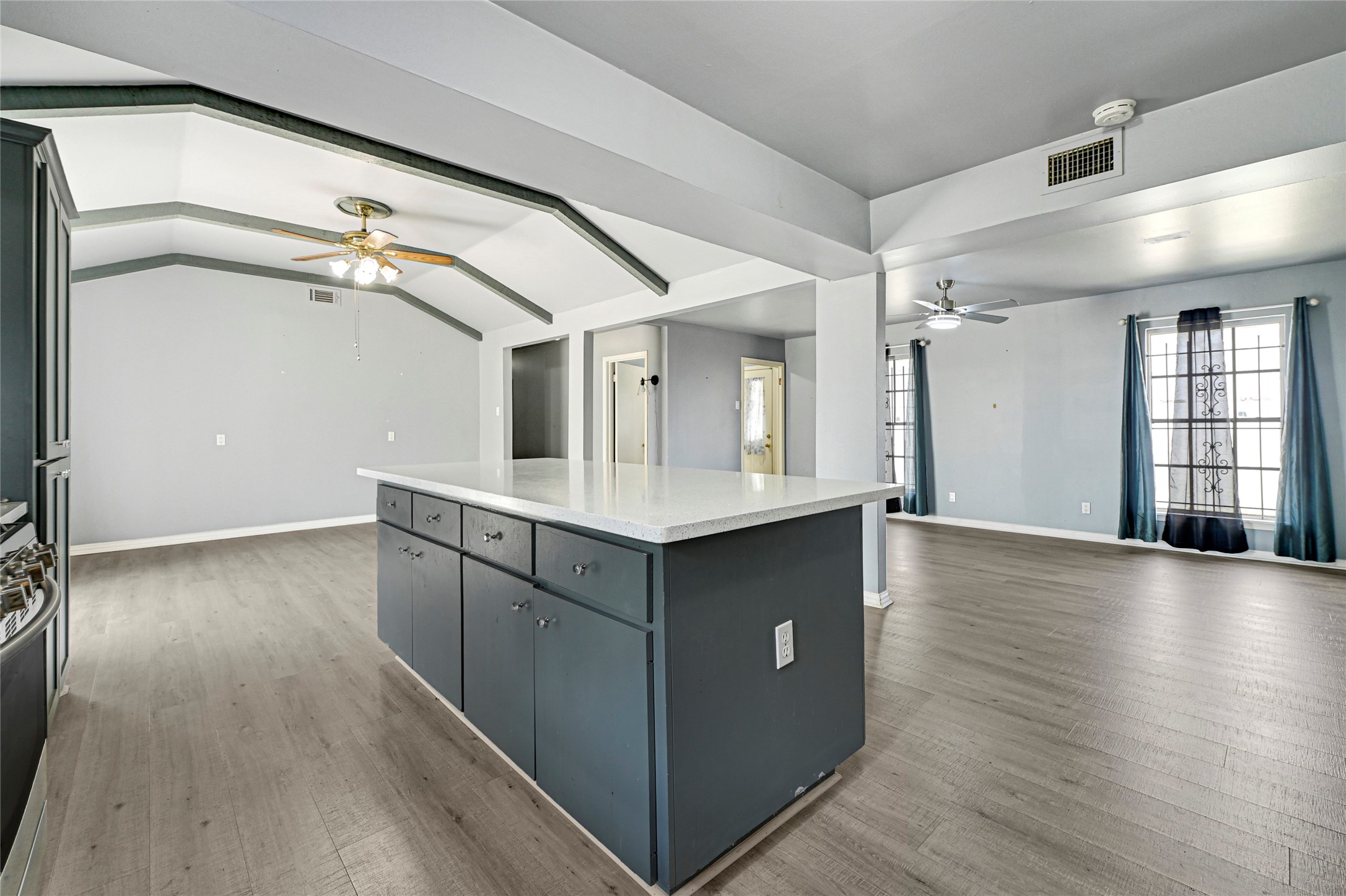 5510 Aldine Bender Road Houston, TX 77032 - Photo 8 of 24 a kitchen with granite countertop a stove and a wooden floors