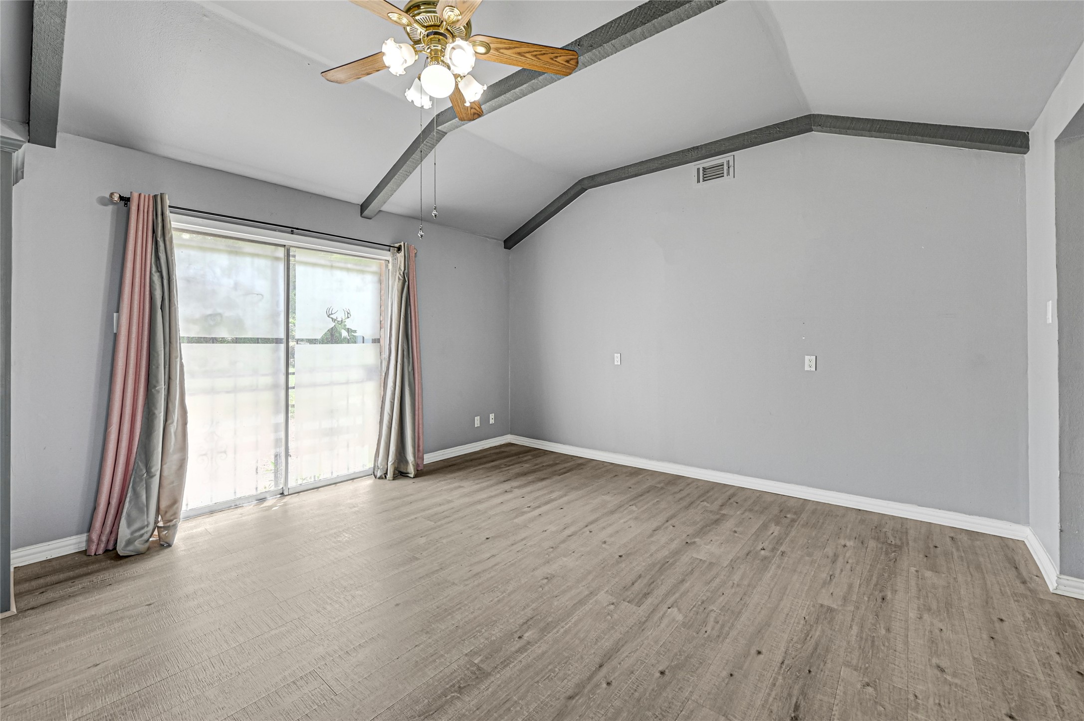 5510 Aldine Bender Road Houston, TX 77032 - Photo 9 of 24 an empty room with wooden floor and windows