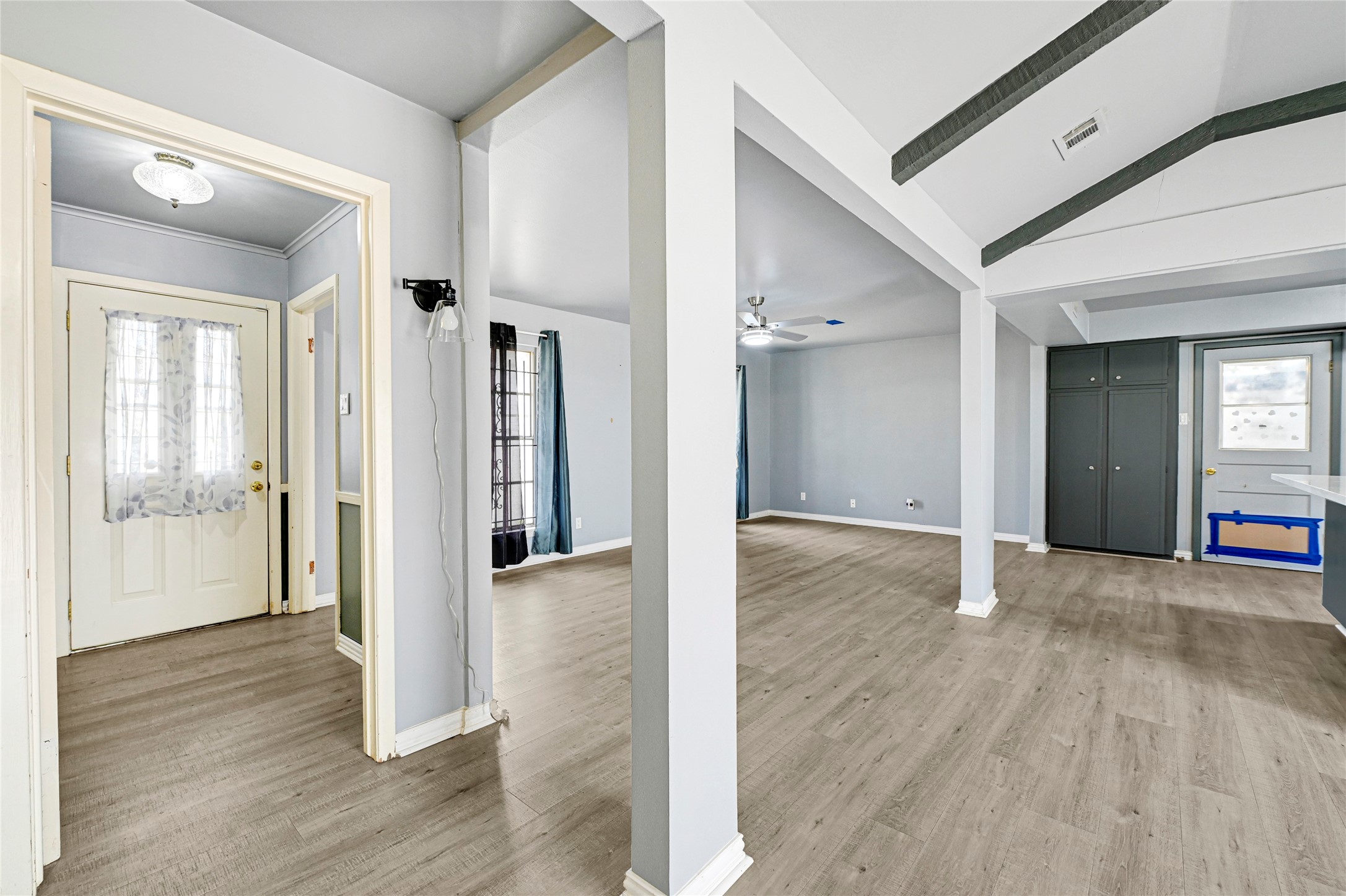 5510 Aldine Bender Road Houston, TX 77032 - Photo 10 of 24 a view of a hallway with wooden floor and windows