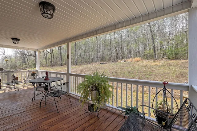 a view of a chairs and table in the patio