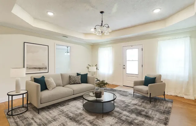 a living room with furniture and a large window