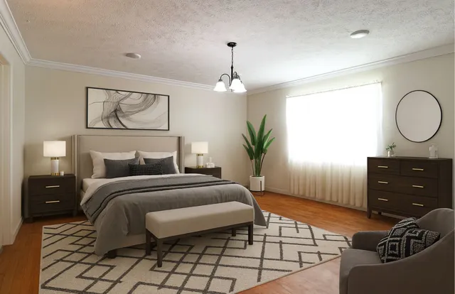 a bedroom with a bed and ceiling fan