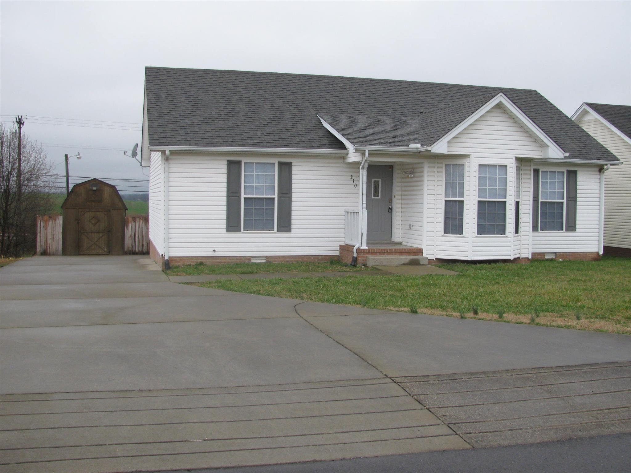 210 Travis Lane Springfield, TN 37172 - Photo 2 of 11 a view of a yard in front view of a house