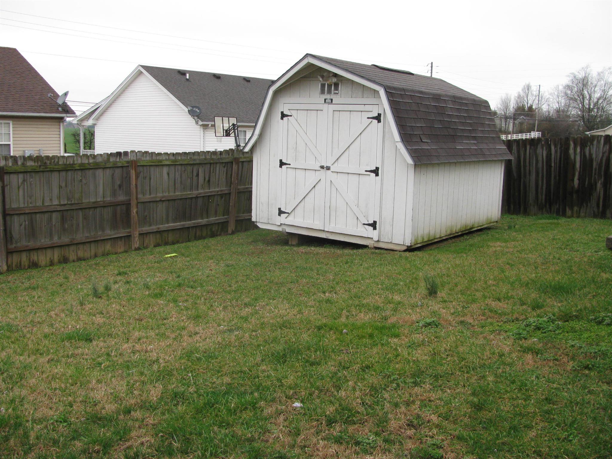 210 Travis Lane Springfield, TN 37172 - Photo 3 of 11 a view of backyard with small cabin