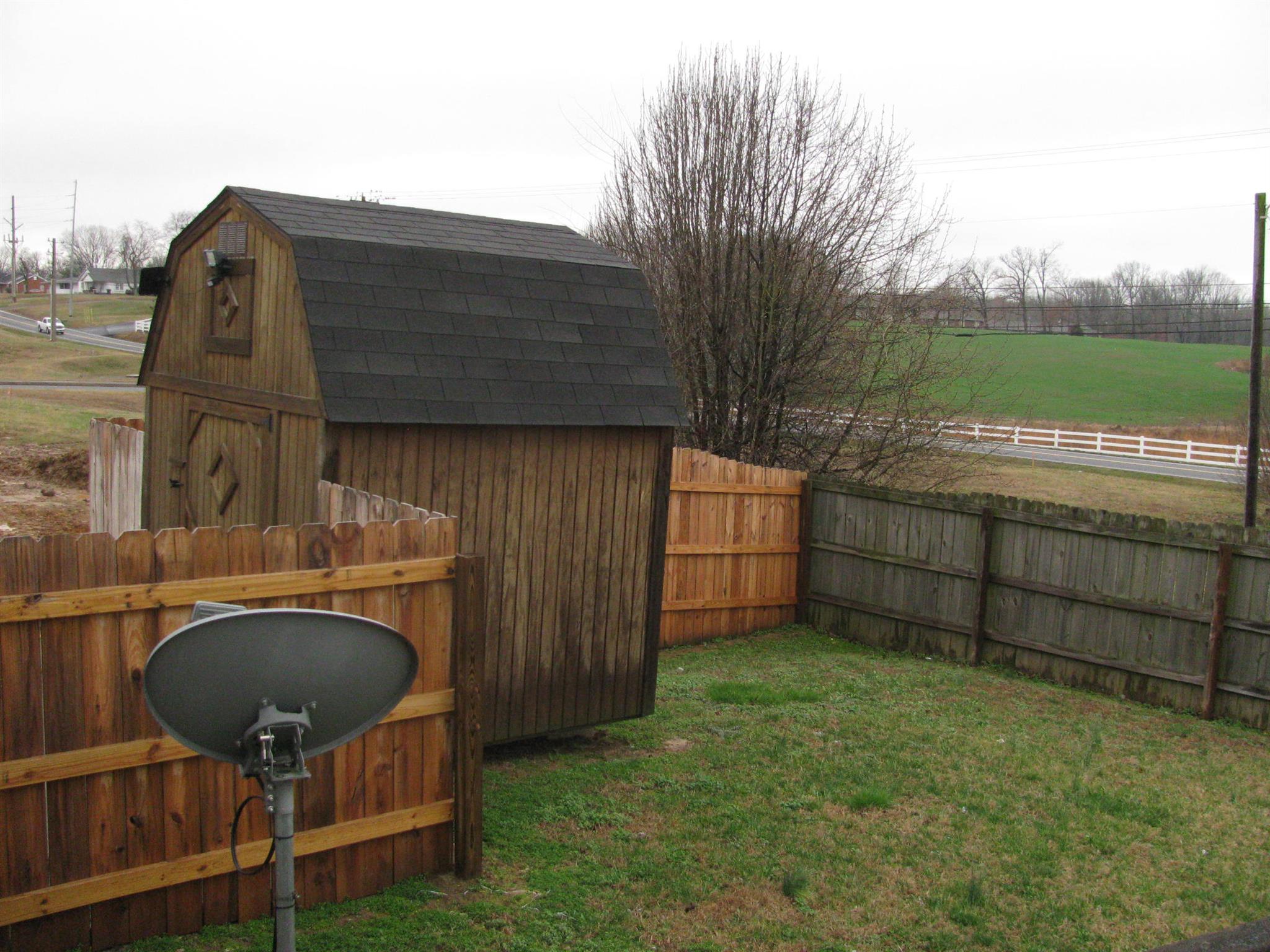 210 Travis Lane Springfield, TN 37172 - Photo 4 of 11 a backyard of a house with table and chairs