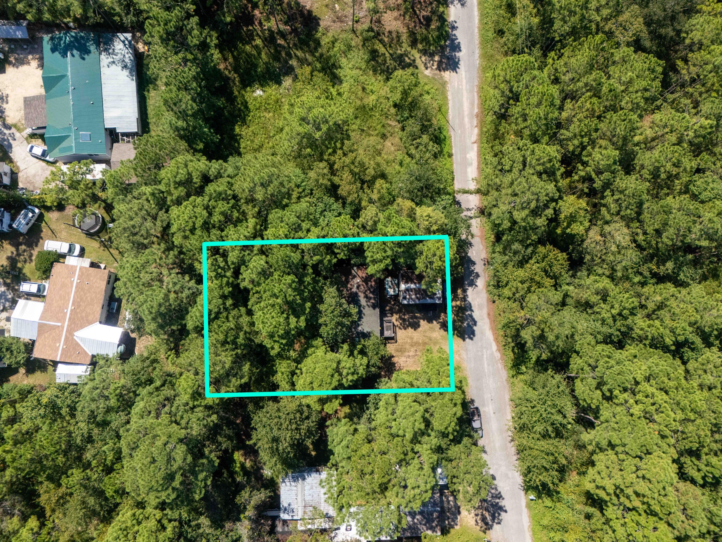 155 4th Street Santa Rosa Beach, FL 32459 - Photo 2 of 9 a view of a yard