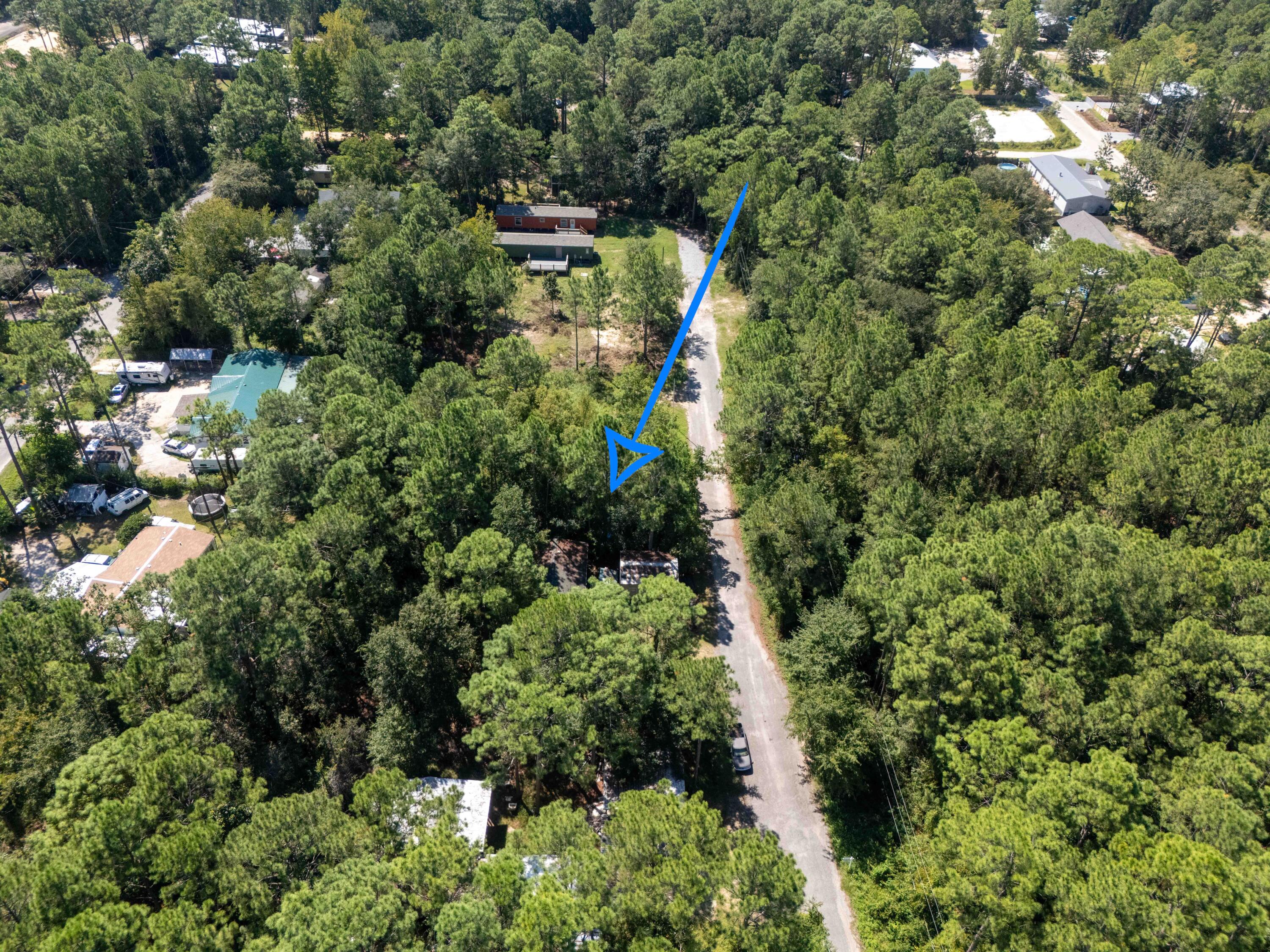 155 4th Street Santa Rosa Beach, FL 32459 - Photo 7 of 9 an aerial view of a house with a yard