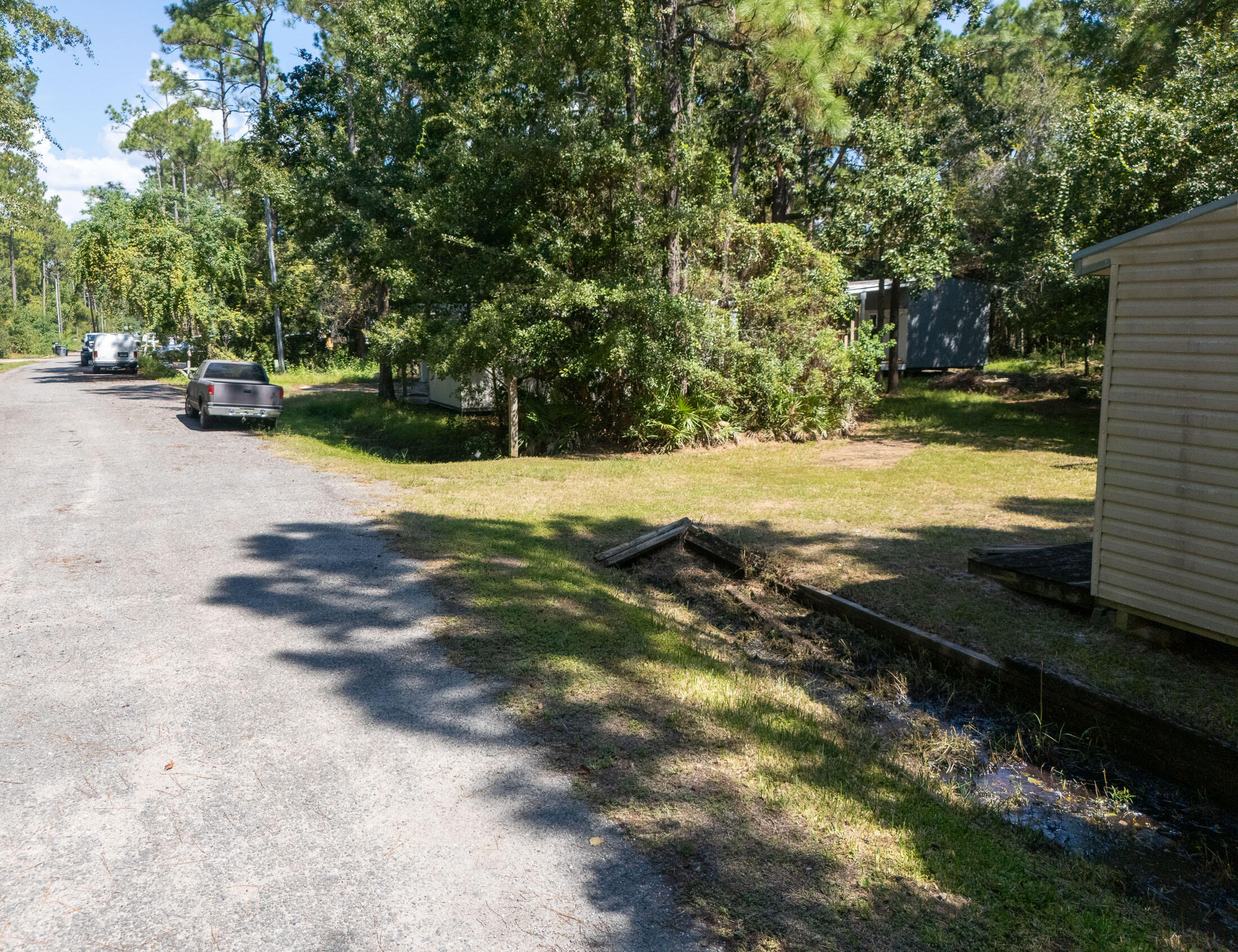 155 4th Street Santa Rosa Beach, FL 32459 - Photo 8 of 9 a view of road with large trees