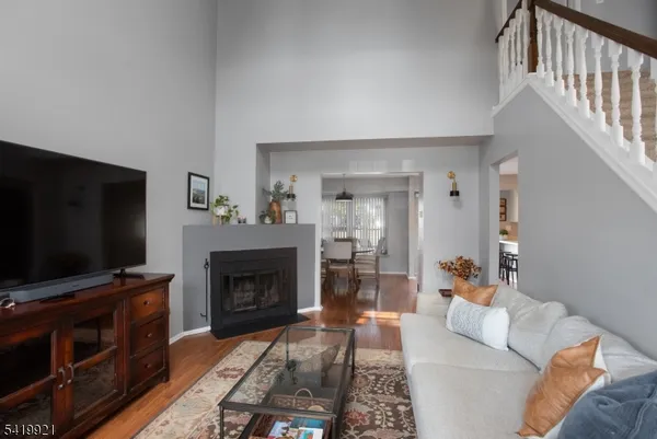 a living room with furniture and a fireplace or television