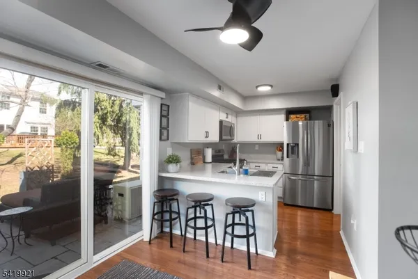 a kitchen with refrigerator a sink and cabinets