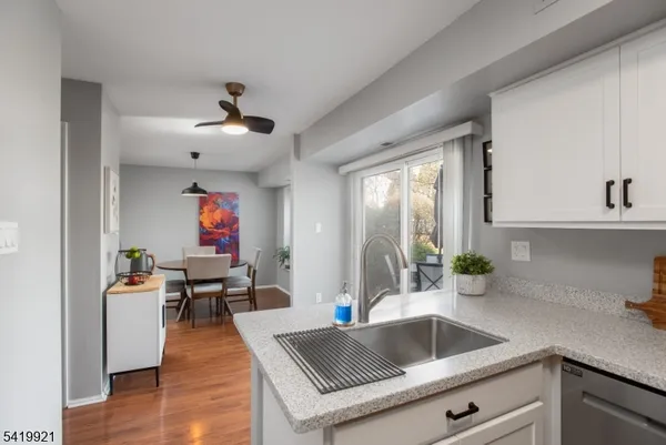 a kitchen with a refrigerator and a sink
