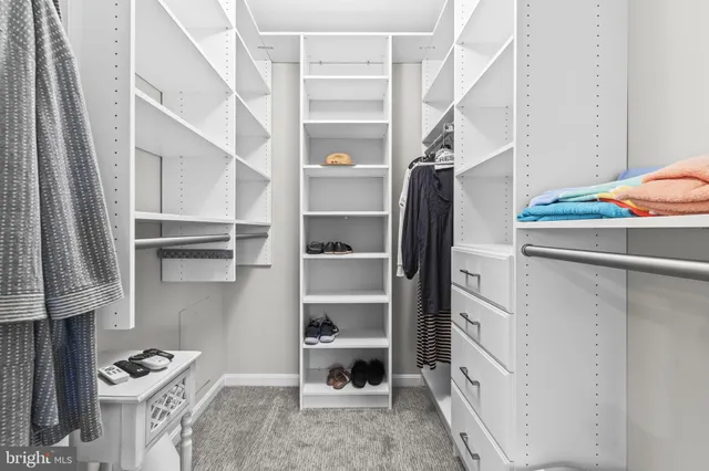 a view of a livingroom with a furniture and kitchen view