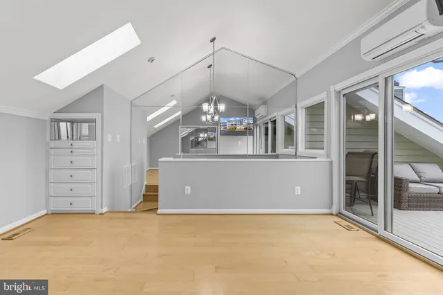 a view of water with boats and trees in the background