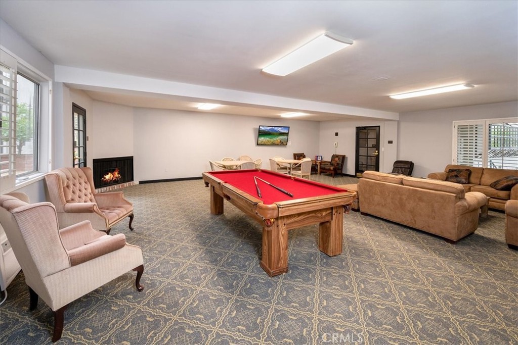 330 South Mentor Avenue, Unit 202 Pasadena, CA 91106 - Photo 15 of 16 a living room with furniture and a fireplace