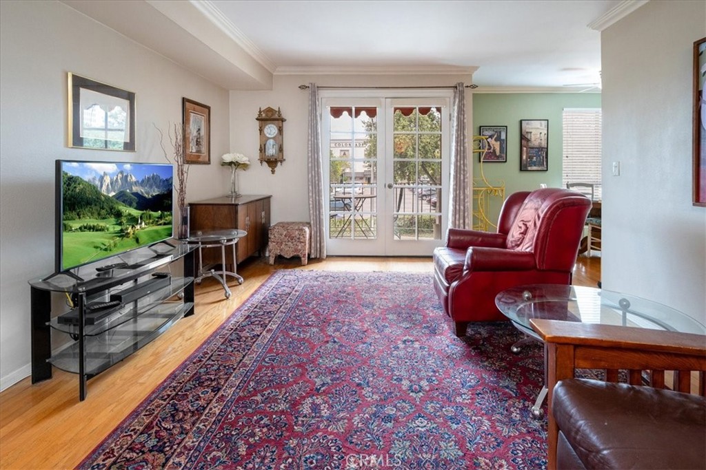 330 South Mentor Avenue, Unit 202 Pasadena, CA 91106 - Photo 6 of 16 a living room with furniture a flat screen tv and large window